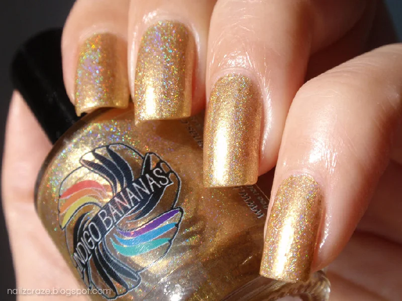 nail polish ritual red-Executive Transvestite - gold linear holo / foil with flakies DISCONTINUED