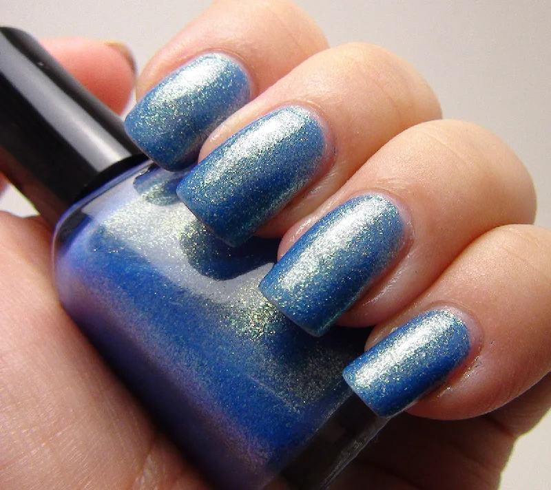 nail polish backstage pass-Great Scott! - blue w/ gold glass fleck shimmer - GLOWS blue