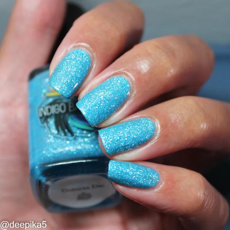 nail polish steppe green-Dolores Dei - sky blue holo flakie